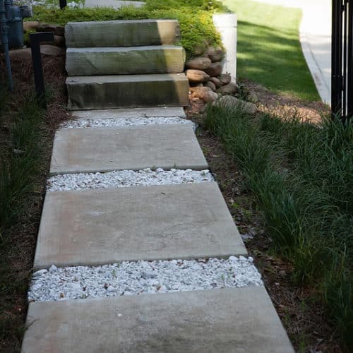 Modern pathway with concrete, gravel and stone steps