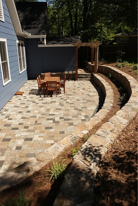 Recycled granite paver patio with stone terraced walls