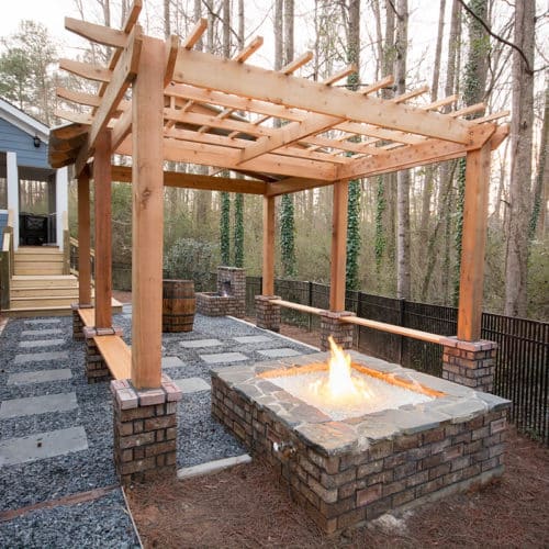 Backyard custom patio with fire pit and pergola