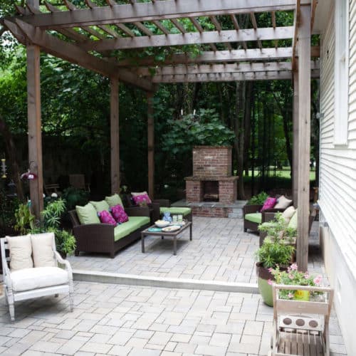 Peaceful backyard patio with pergola and fireplace