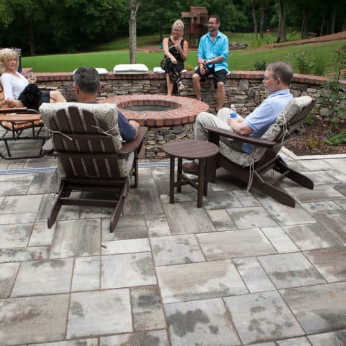Belgard concrete paver patio with stone seat wall and brick cap