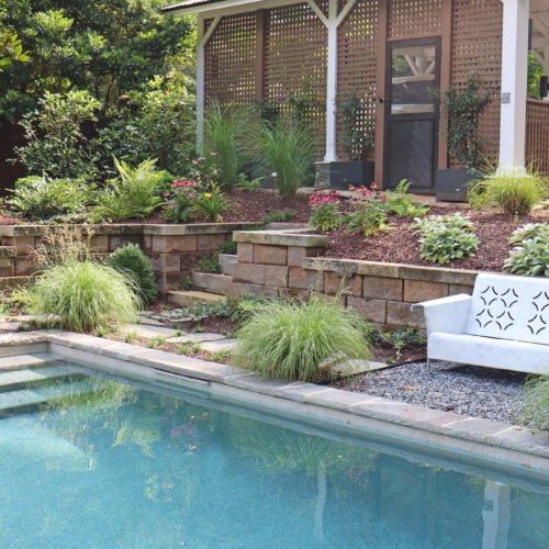 Backyard landscape with retention and pool