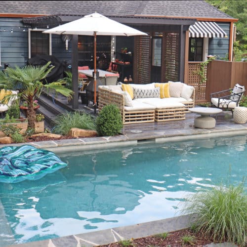 Family outdoor living space with pool, deck and seating