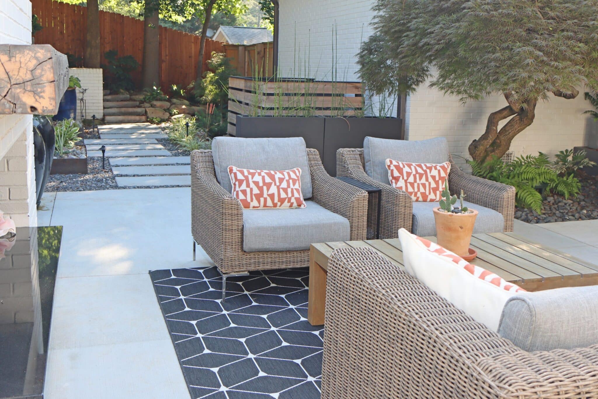 Midcentury modern patio space with concrete panel pathway