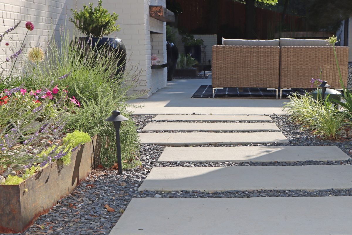 Modern concrete panel pathway and steel planter