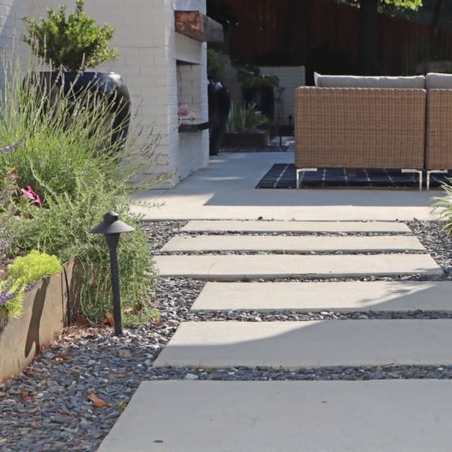 Modern concrete panel pathway and steel planter