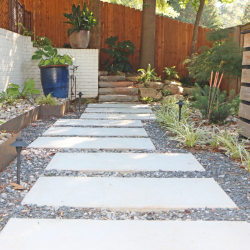 Modern concrete panel pathway with crushed slate gravel