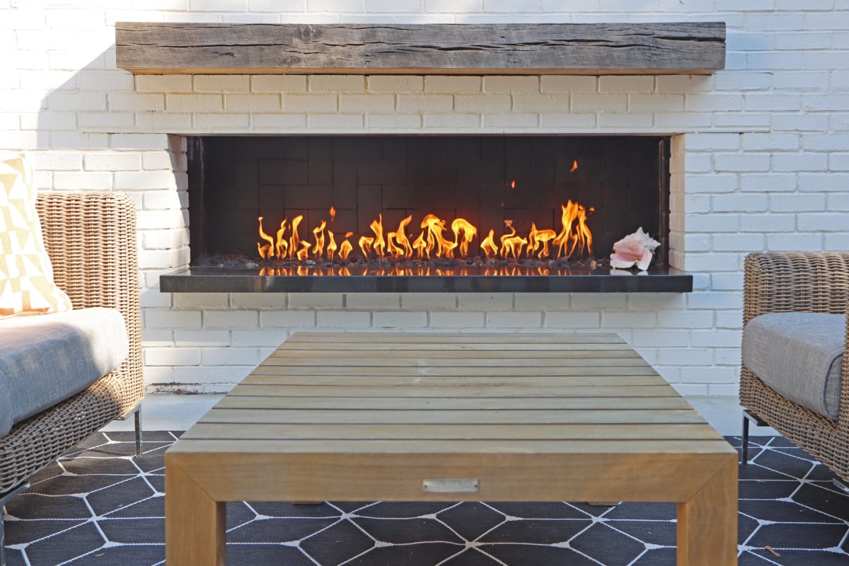 View of modern patio with fireplace