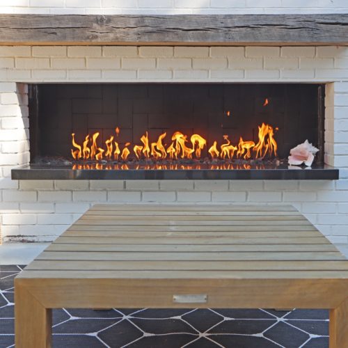 View of modern patio with fireplace